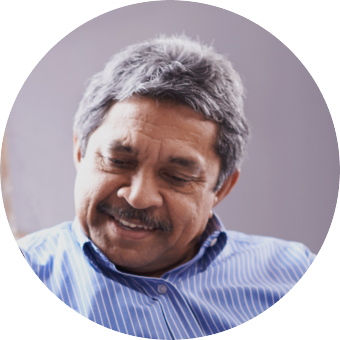 Man in blue striped shirt looking down