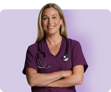 Nurse smiling in burgundy scrub shirt with purple background